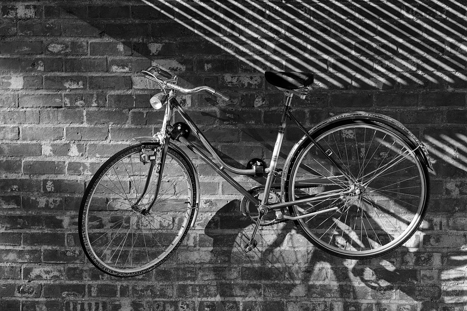 bicycle & shadow on the wall