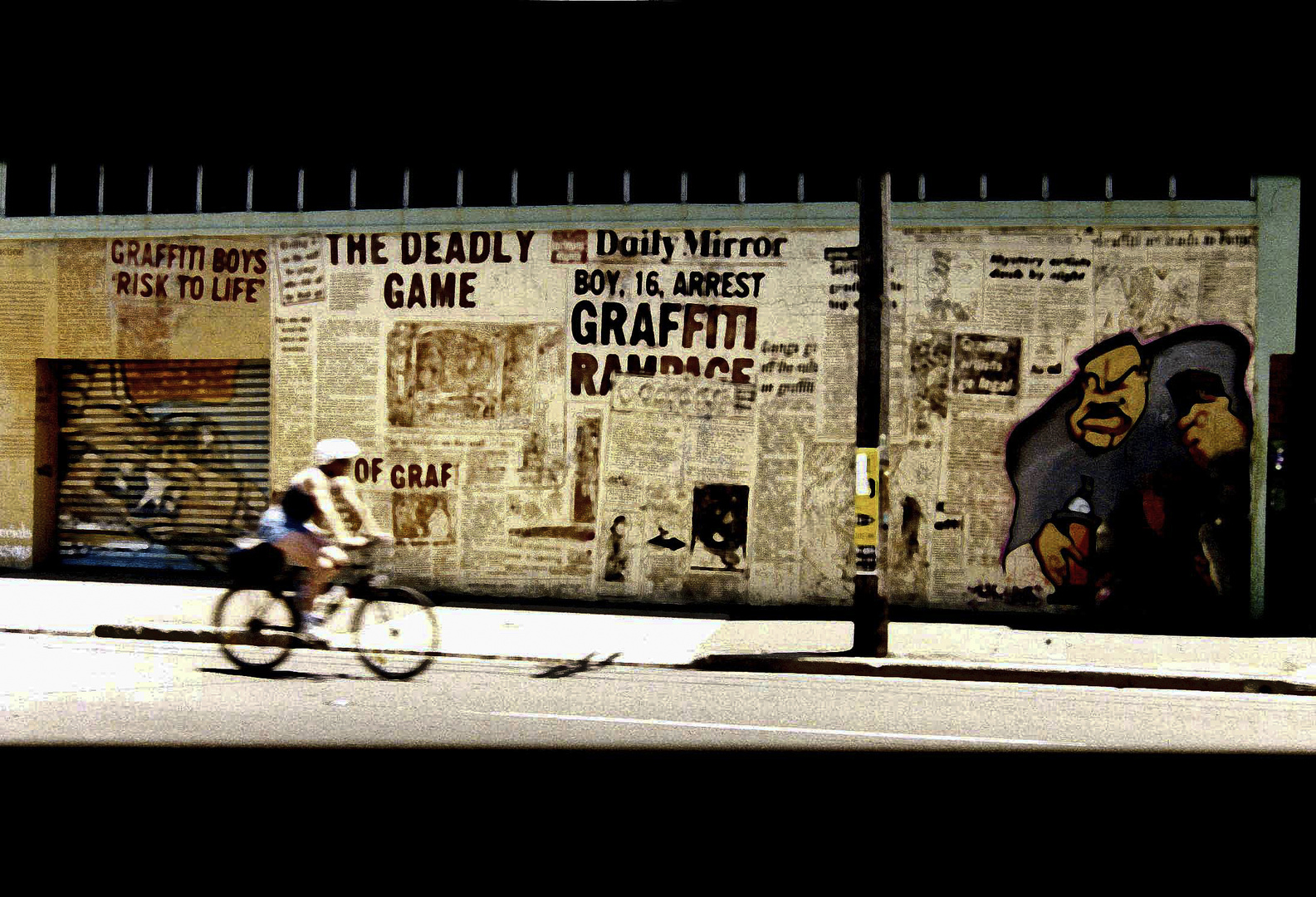 bicyclist and graffiti