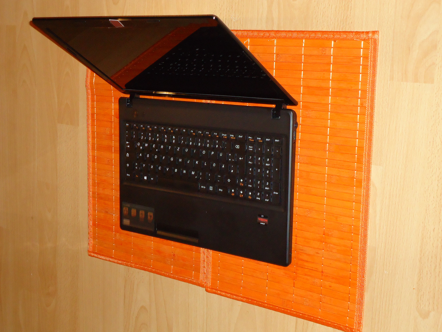 black laptop meets orange