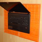 black laptop meets orange