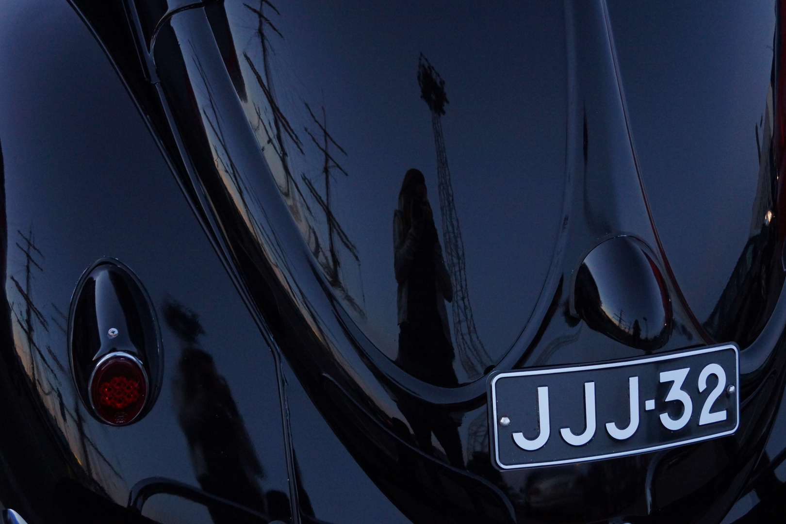 Black old car reflection