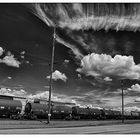 Black Train In Clouds & Car