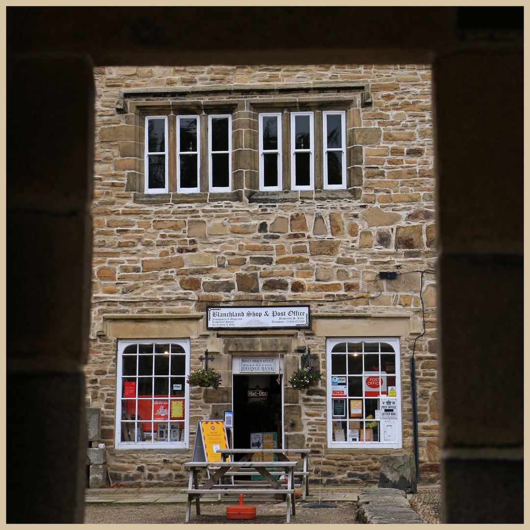 Blanchland post office through the arch