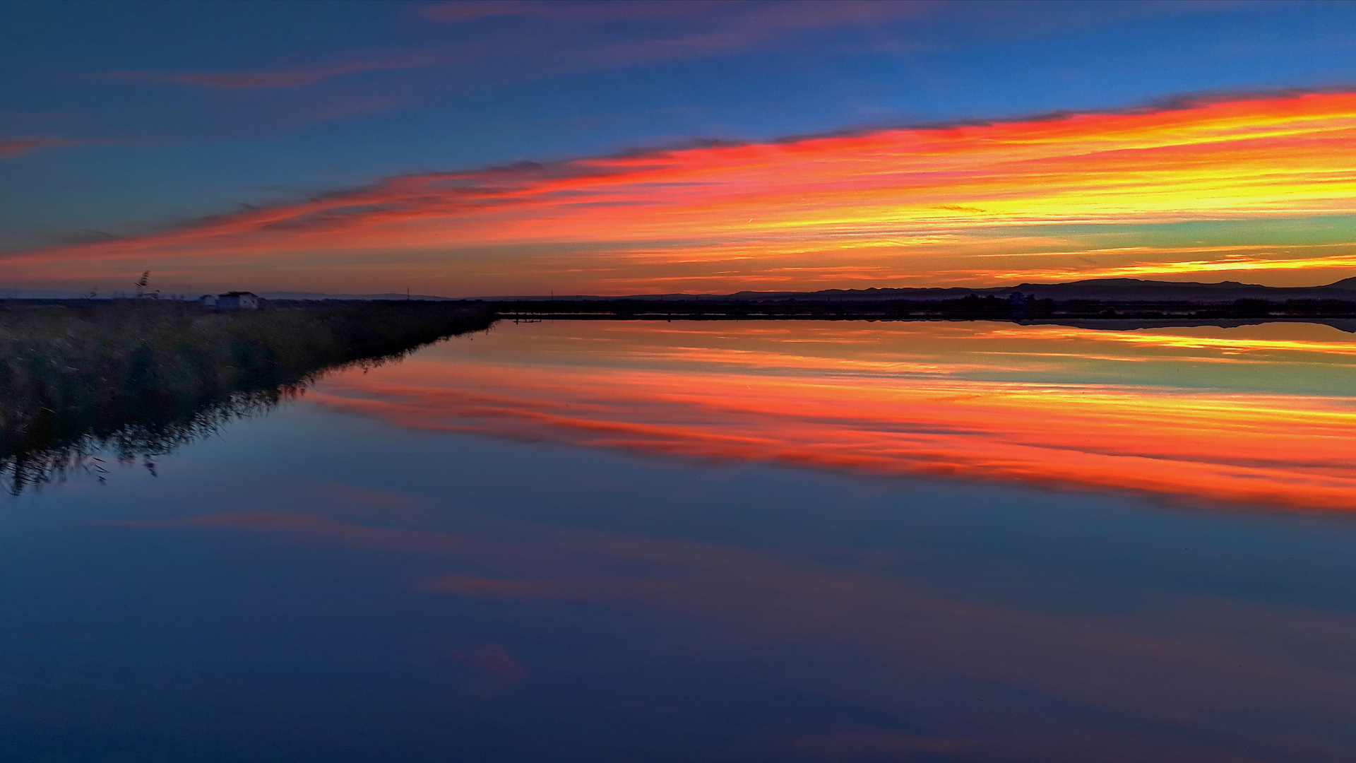 Blau, rot, gelb am Albufera See