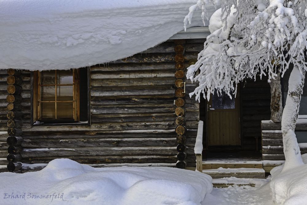 Blockhütte im Winter