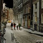 Bloedstraat Amsterdam. Four schoolgirls walking through a Red Light District street.
