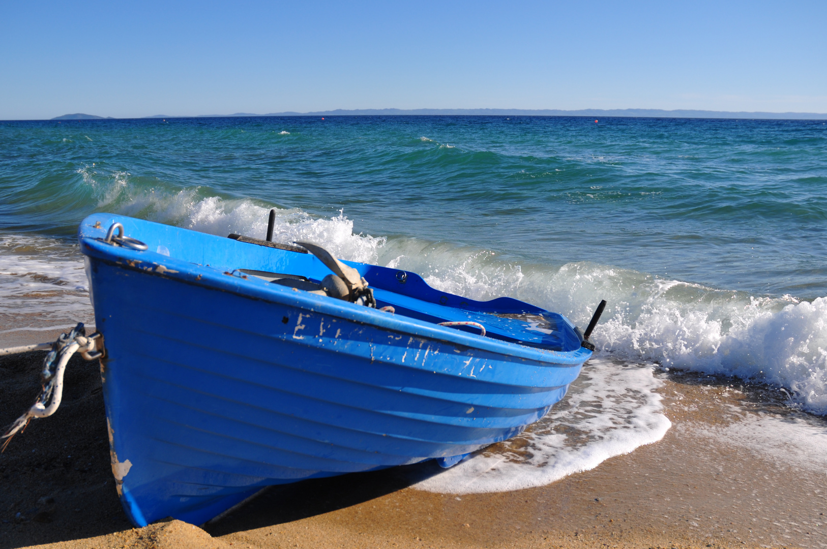 Blue boat on the beach