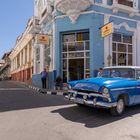 blue car - blue building