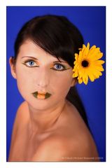 Blue eyes and yellow flower