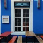 blue house - white window - two red table