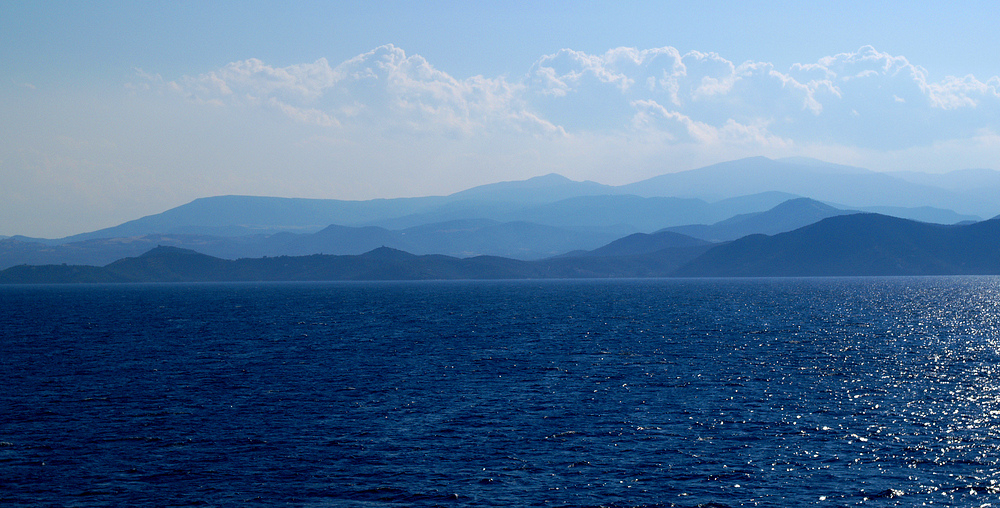 Blue Sea, blue mountains, blue sky