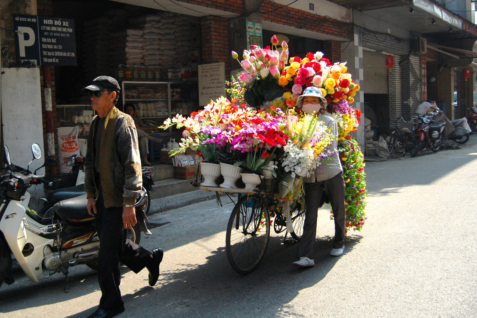 Blumenverkäuferin Hanoi