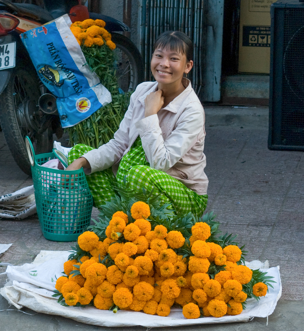 Blumenverkäuferin in Vietnam