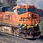 BNSF #7796 ES44DC leads a long freight train over the Tehachapi Loop, CA, USA