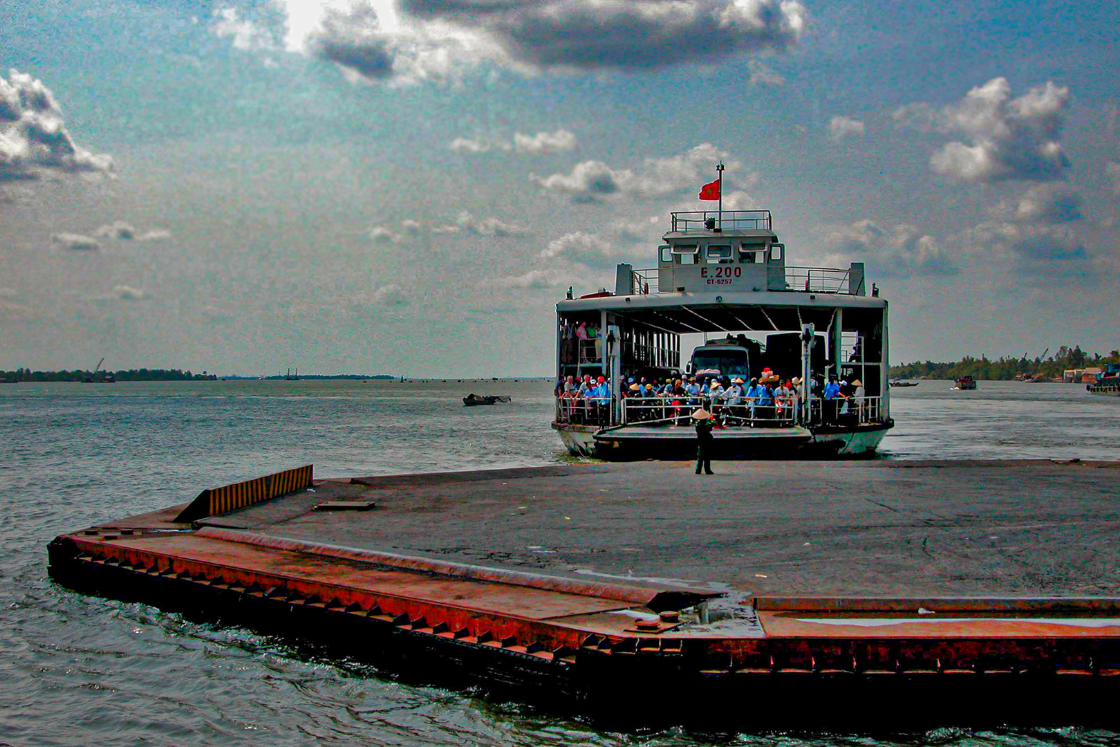 Boarding the ferry to across the Mekong branch