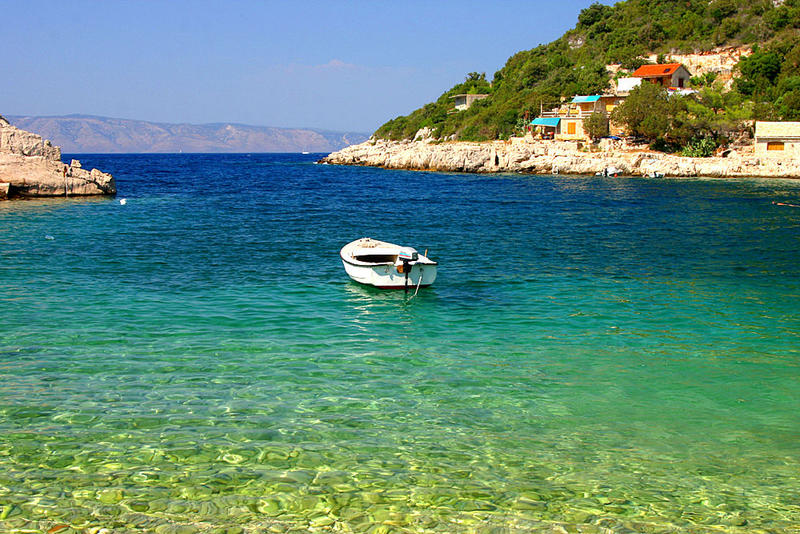 Boat in adriatic´s changing blue