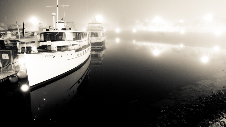 boat in harbor fog