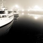 boat in harbor fog