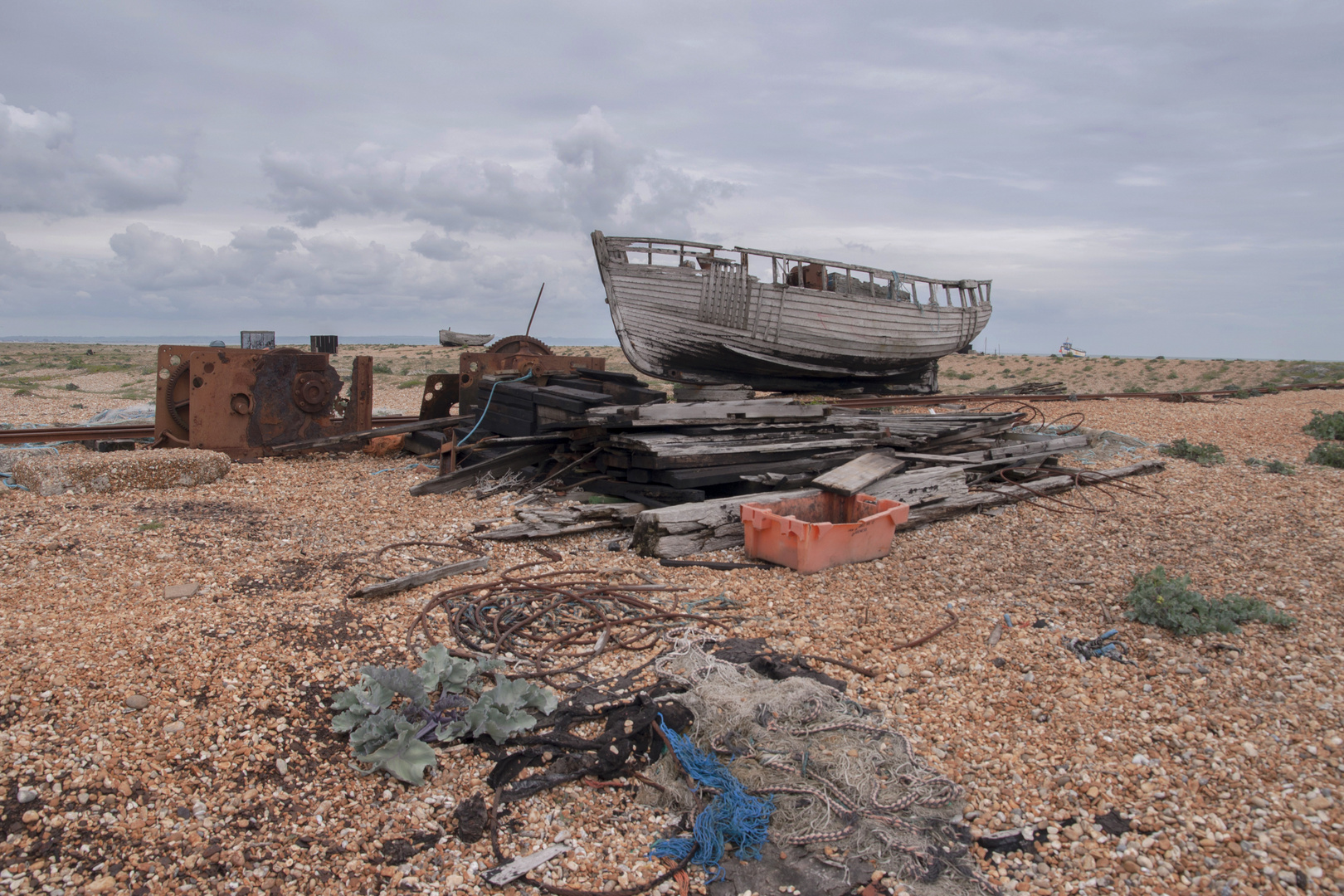 Boat yard ensmable on a gery day.