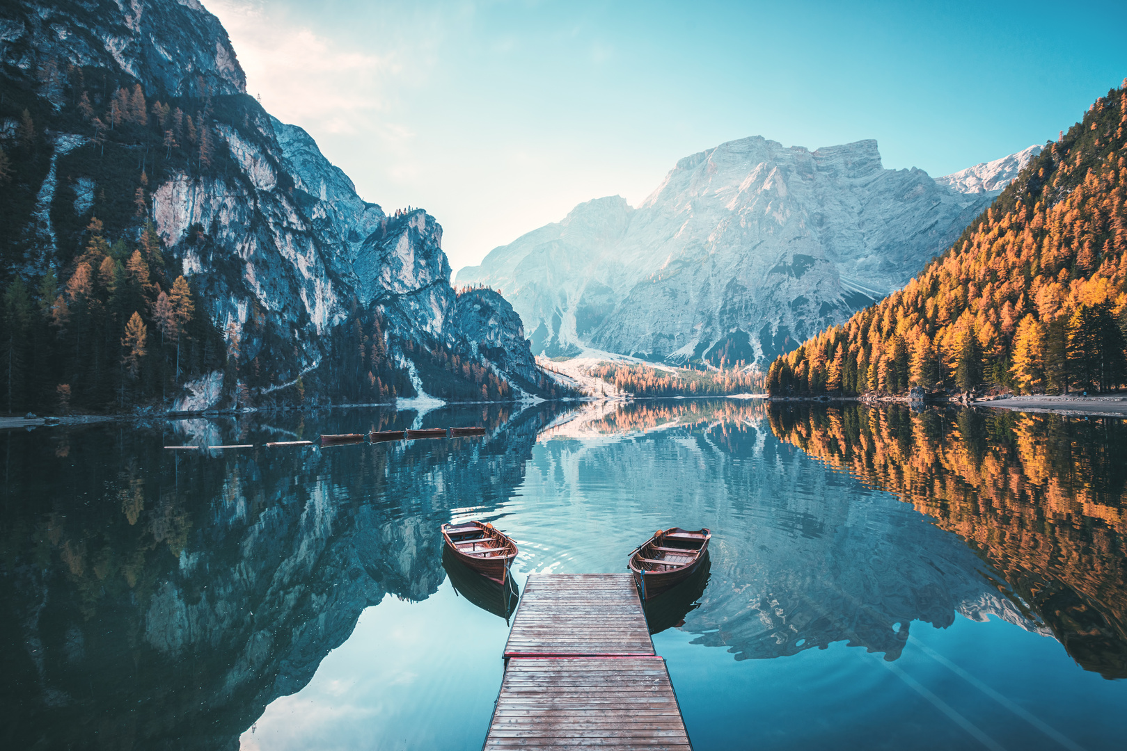 Boats on the Braies Lake ( Pragser Wildsee ) in Dolomites mountains, Südtirol, Italy