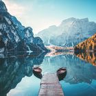 Boats on the Braies Lake ( Pragser Wildsee ) in Dolomites mountains, Südtirol, Italy