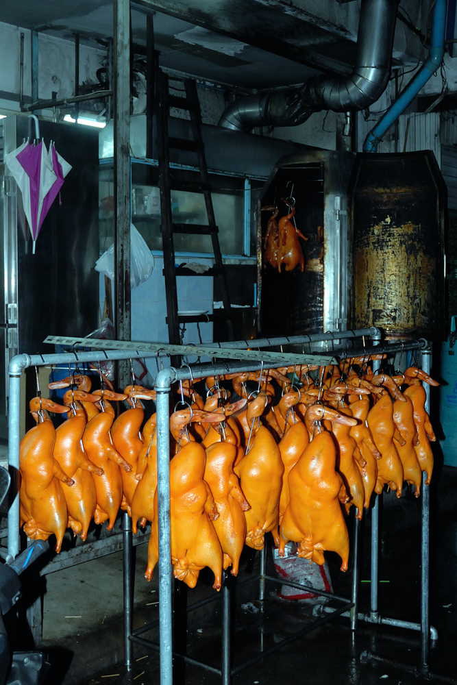 Bodies hanging to get prepared for Peking duck