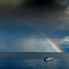 Boot unterm Regenbogen