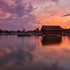 Bootshaus am Chiemsee bei Sonnenuntergang