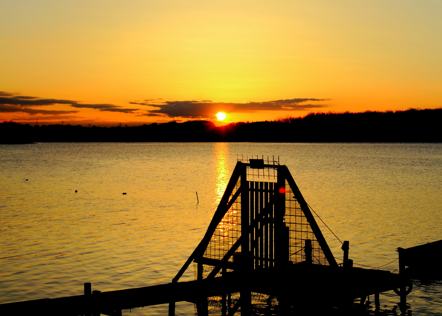 Bootssteg bei Sonnenuntergang