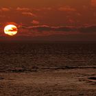 Borkum: Sonnenuntergang mit kupferfarbigen Abendwolken