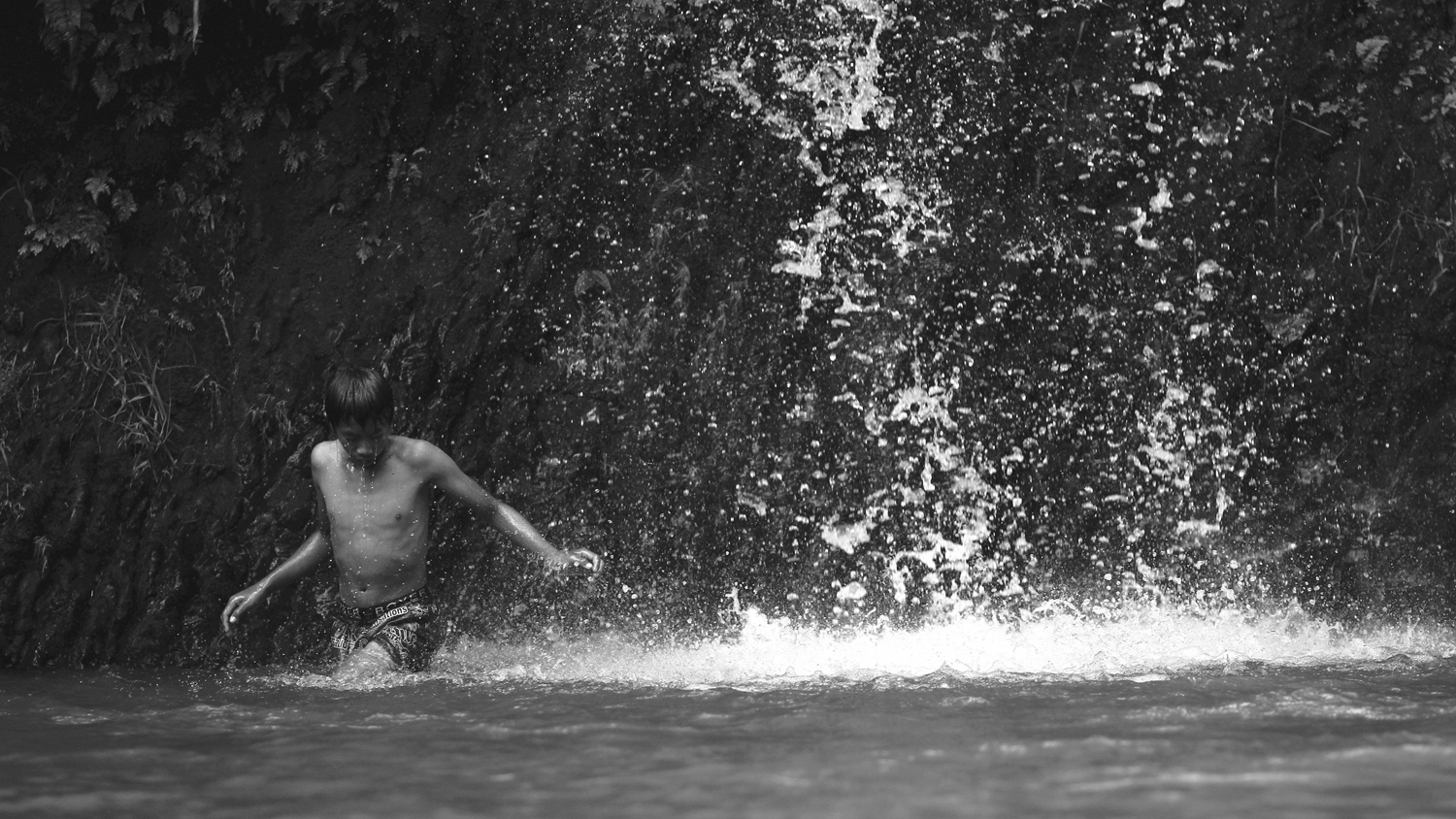 Boy and a waterfall