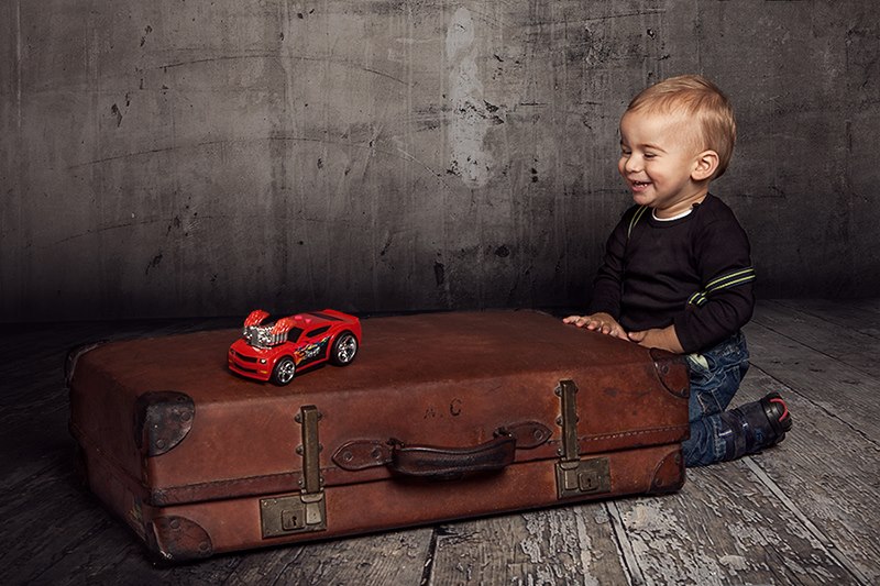 Boy and his red car