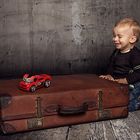 Boy and his red car