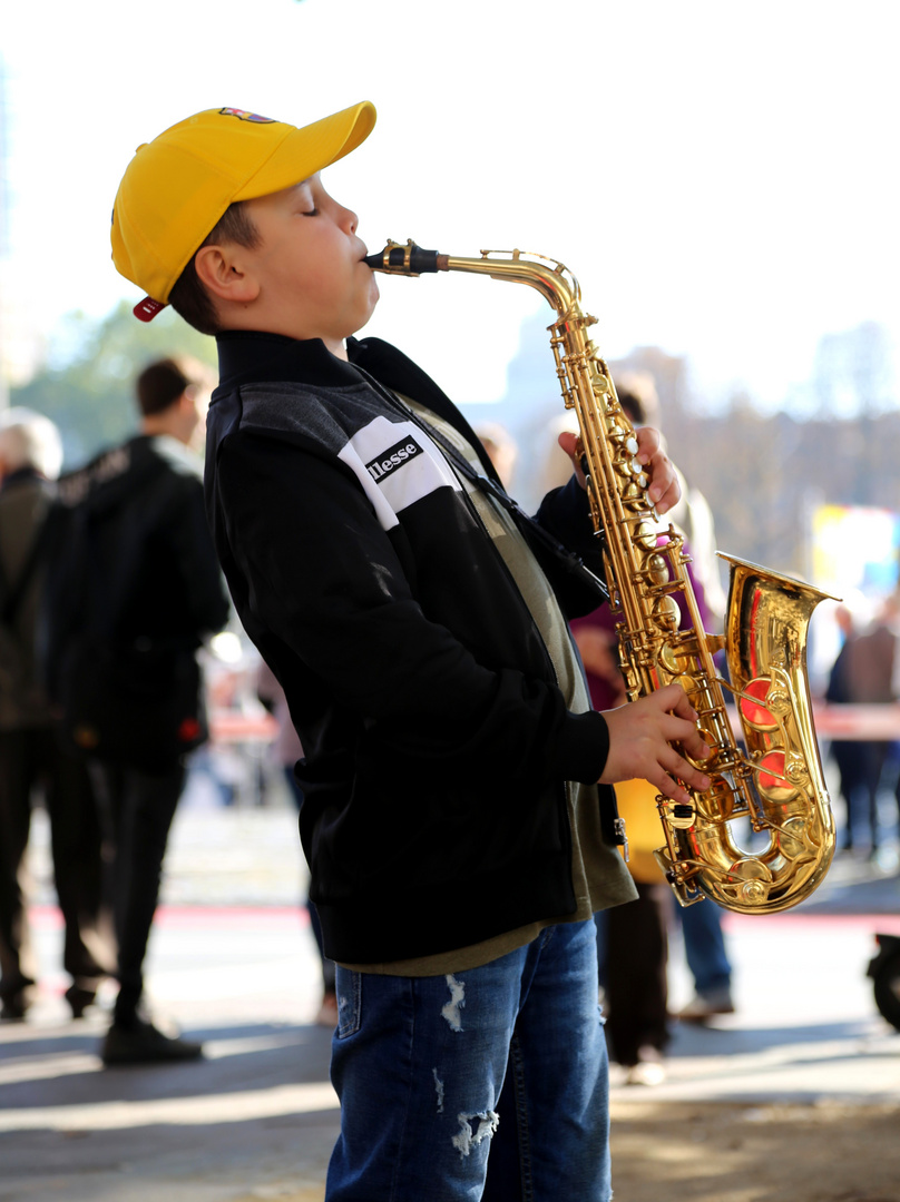 boy playing saxophone