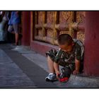 Boy playing with Toy in the Forbidden City