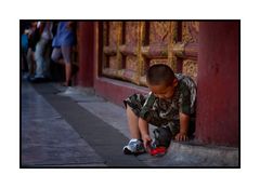 Boy playing with Toy in the Forbidden City