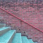 Brick wall with handrail and stairs