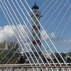 Bridge in front of lighthouse