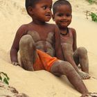 brothers playing with sand