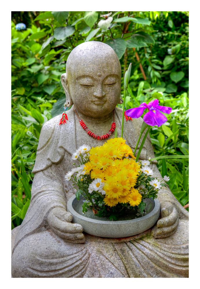 Buddha statue with flowers