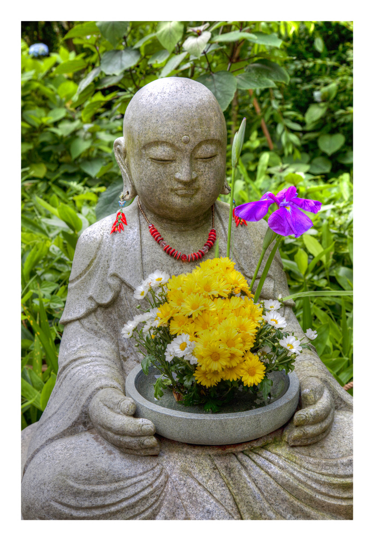 Buddha statue with flowers