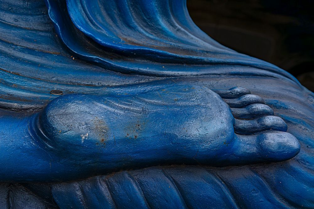 Buddhas blauer Fuß