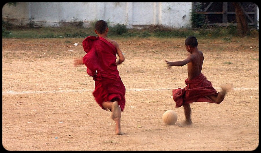 Burmese Buddhist novices playing football