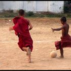 Burmese Buddhist novices playing football