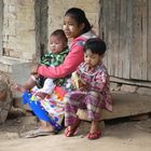 Burmese family with thanaka make-up