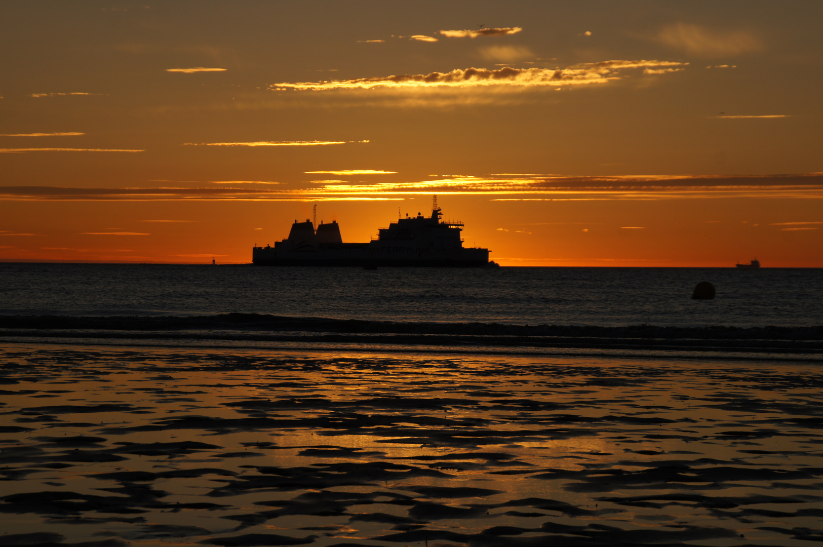 Calais Sonnenuntergang silhouette bei ebbe