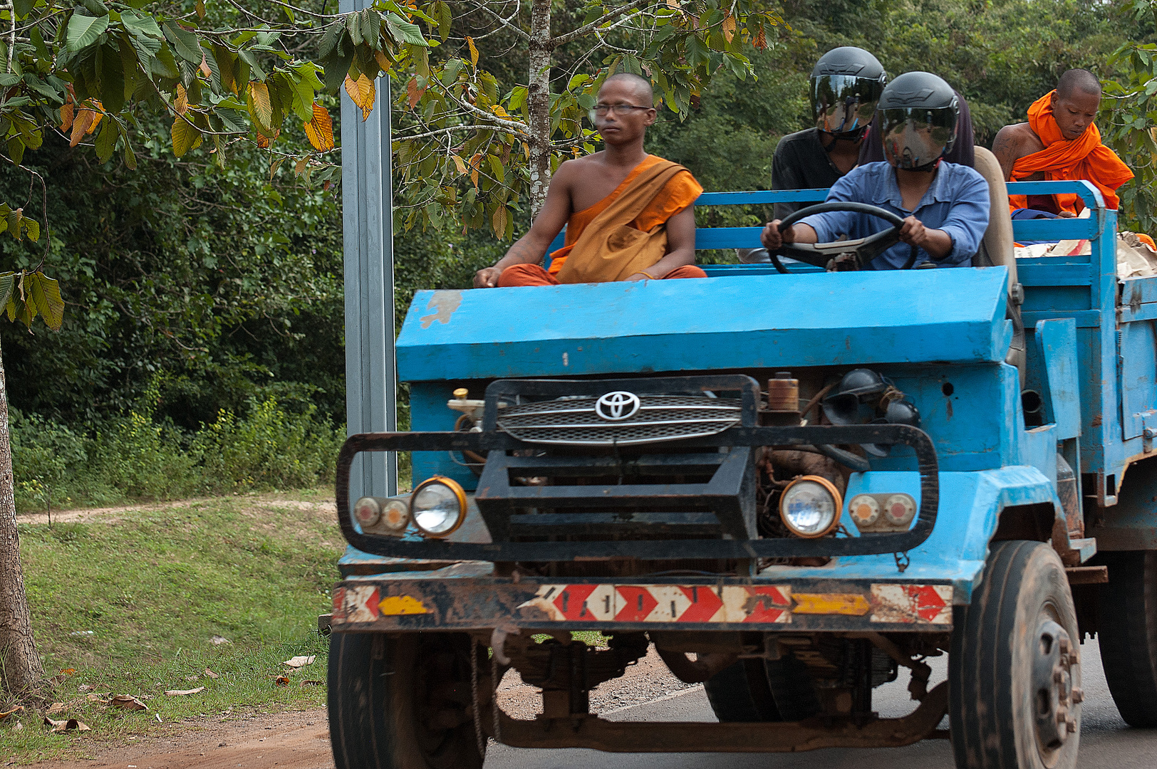 Cambodia...some are protected by god, the others need an helmet...