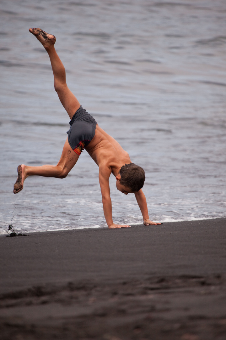 cartwheels on the sand