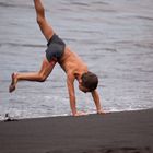 cartwheels on the sand