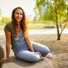 Charleen sitting on a wall